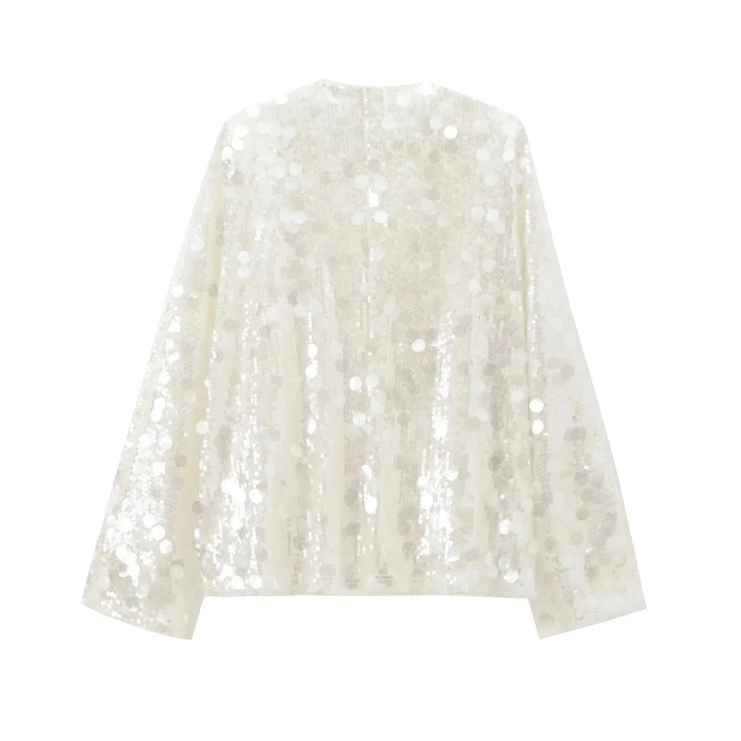 Ivory sequin v-neck blouse for women by Carrington, featuring elegant sequin detailing on a classic v-neck design.