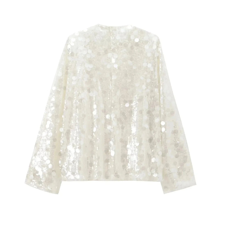 Ivory sequin v-neck blouse for women by Carrington, featuring elegant sequin detailing on a classic v-neck design.