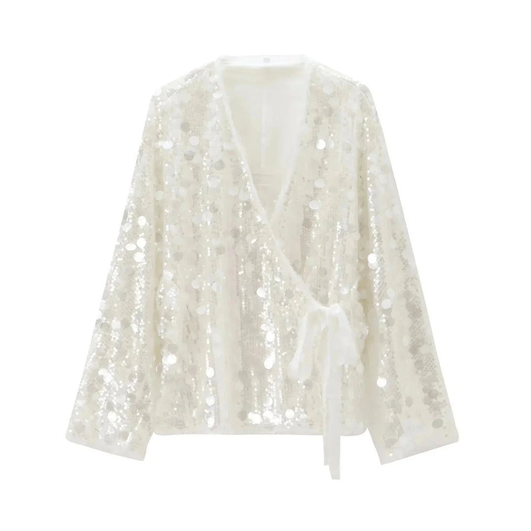 Ivory sequin v-neck blouse for women with elegant design and sparkling accents.
