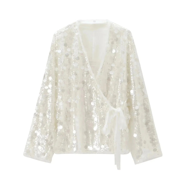 Ivory sequin v-neck blouse for women with elegant design and sparkling accents.