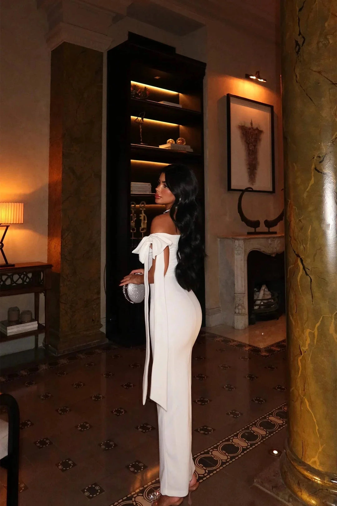 White maxi dress made from flowy, breathable fabric with an elegant fit and timeless design.