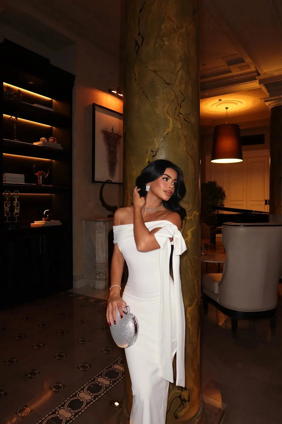 "White maxi dress with tailored fit and elegant design, perfect for special occasions."
