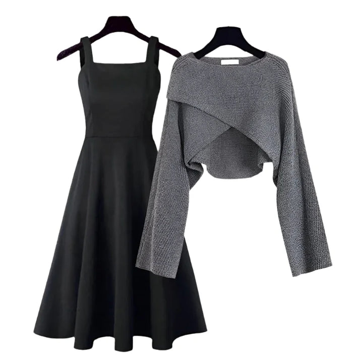 Grey knit dress with asymmetrical sweater detailing by Chandler. Flared silhouette for a stylish and contemporary look.