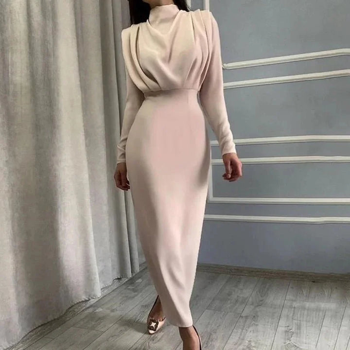 Apricot high-neck maxi dress with dramatic sleeves, perfect for special occasions.