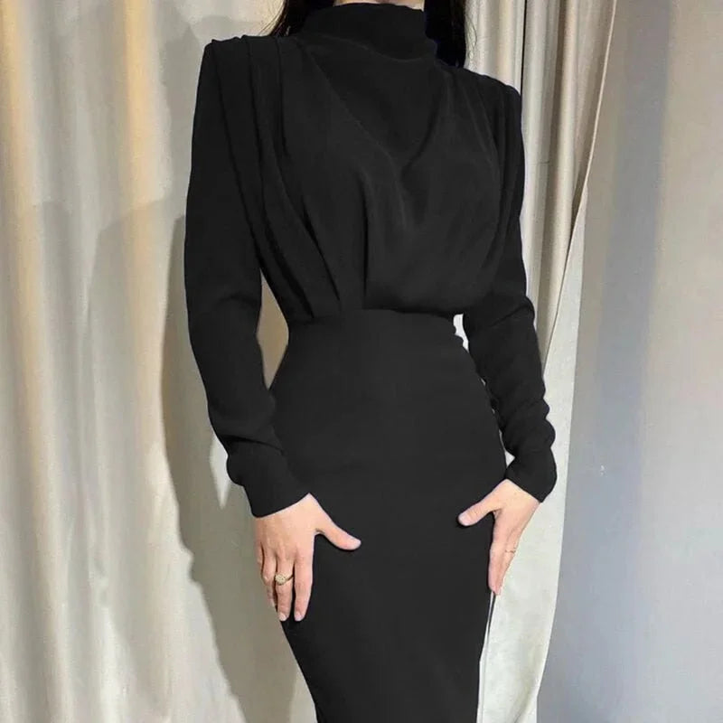 Black high-neck maxi dress with dramatic sleeves, perfect for a sophisticated look. Made from soft, flowing fabric for…