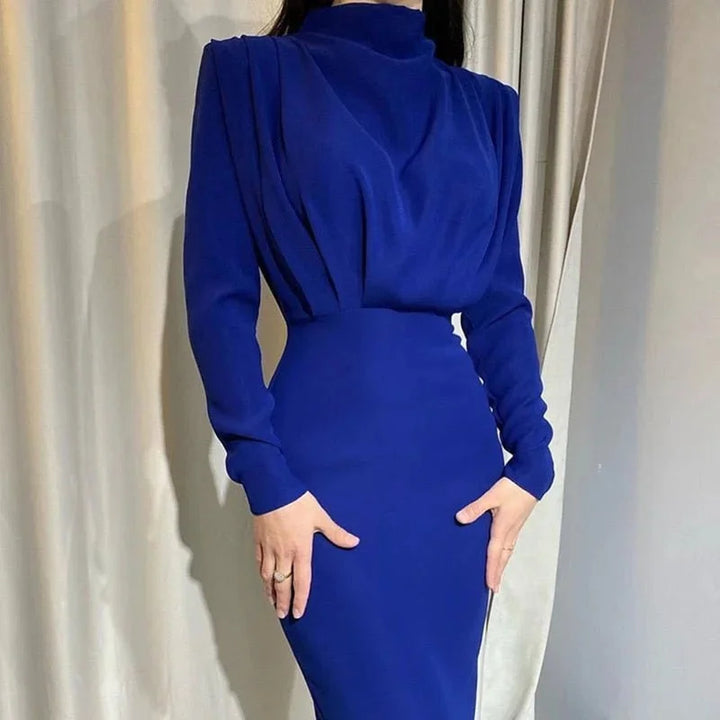 Royal blue high-neck maxi dress with dramatic sleeves, suitable for formal occasions. crafted in a soft fabric with a…