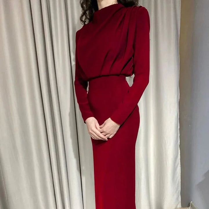 "Wine red high-neck maxi dress with dramatic sleeves, crafted from flowy, elegant fabric. Perfect for special occasions."
