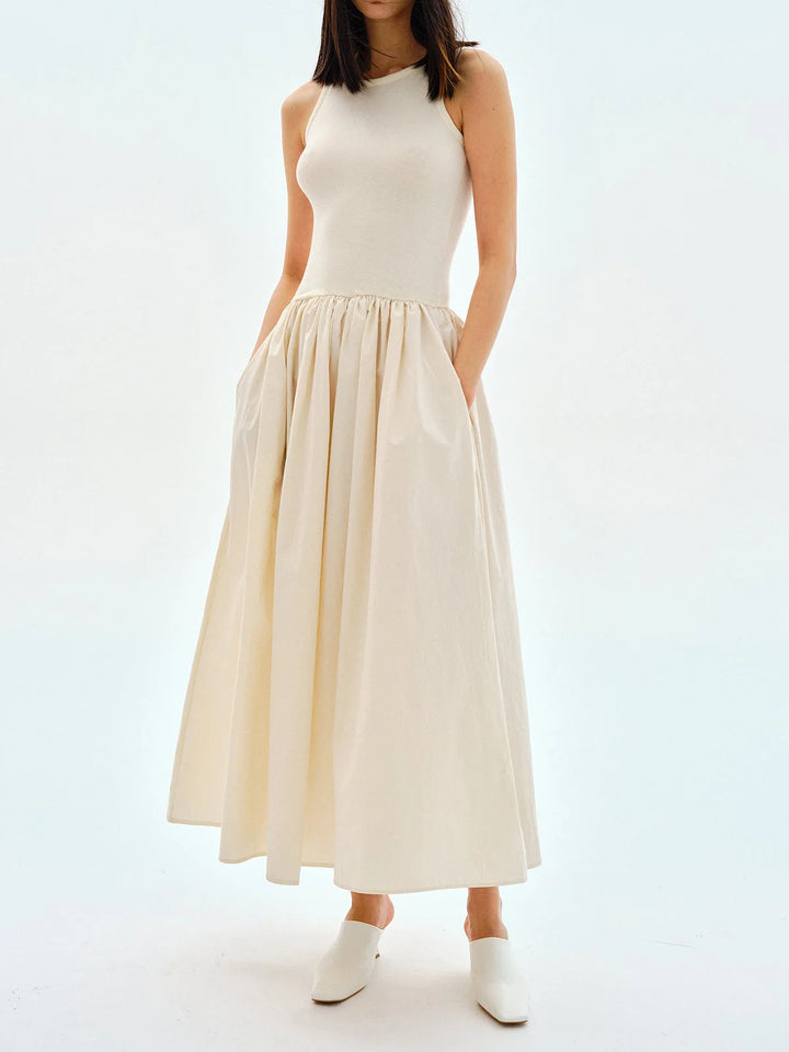 Apricot jersey dress with gathered waist, sleeveless design for a comfortable and stylish look.