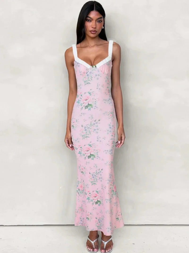 Pink floral maxi dress with ruffle details, perfect for a feminine look. Made with soft, flowy fabric for a comfortable and…