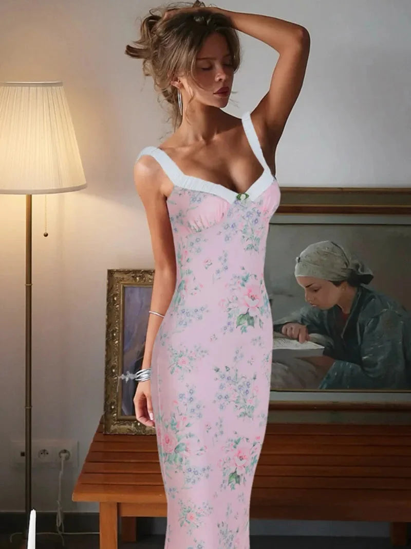 Pink floral maxi dress with ruffle details, perfect for spring. Made of soft cotton blend, features a flattering silhouette…