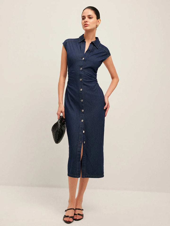 "Dark blue denim midi dress with v-neck and sleeveless design, perfect for casual outings or beach days."