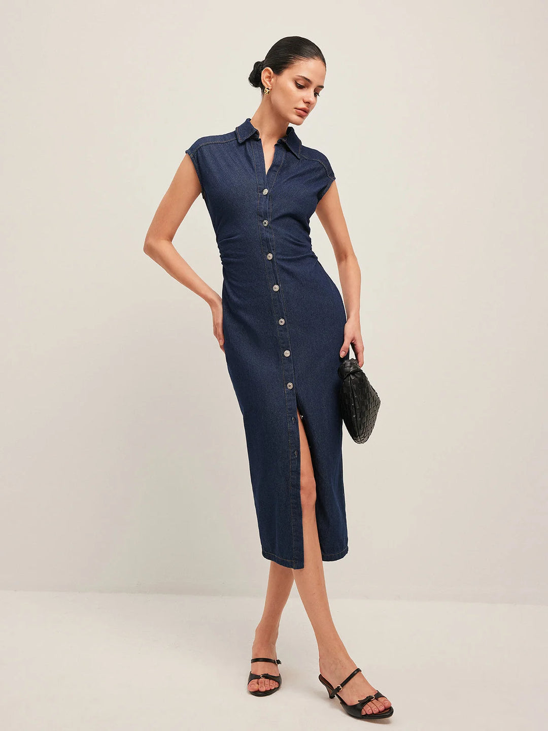 Sleeveless dark blue denim midi dress in Navy, V-neck design, a cool and stylish look for a casual day out or evening…
