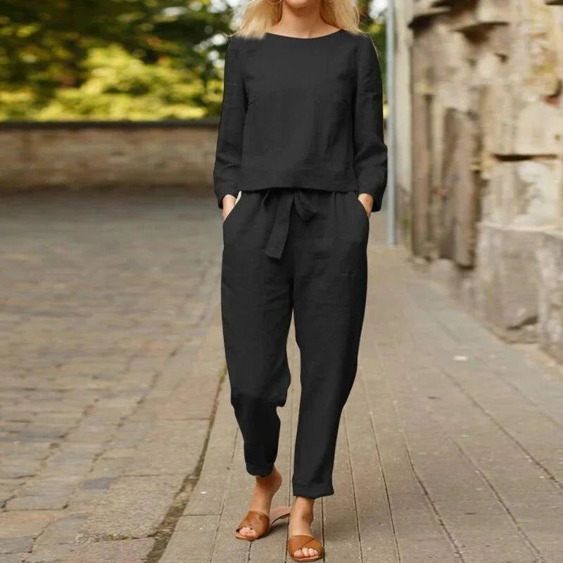 "Black two-piece linen set for women, featuring a breezy design perfect for warm weather, includes top and pants by Cindy."