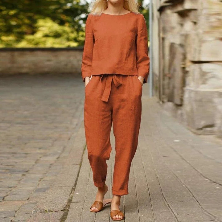 "Red linen two-piece set for women, featuring a breezy design perfect for summer days. Includes top and bottoms."