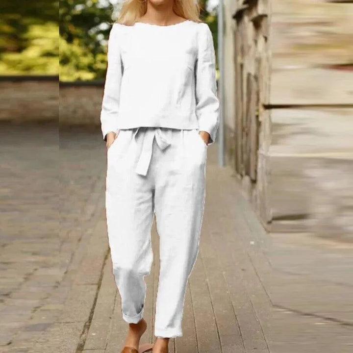 Women's two-piece linen set in White. Features breezy design, perfect for warm days. Ideal for a relaxed yet elegant summer…