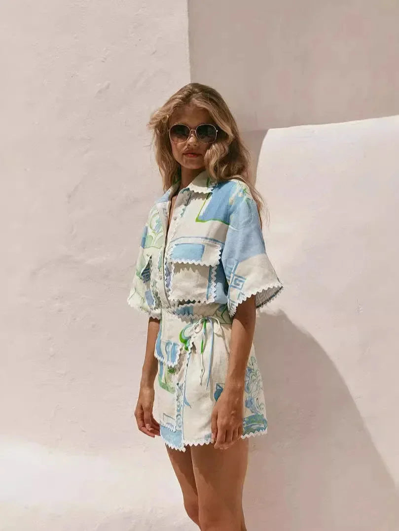Blue and white summer beach set with geometric patterns and tassels, made from lightweight and breathable fabric.