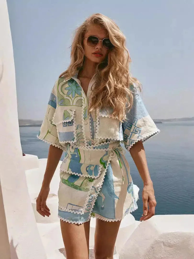 Blue and white summer beach set including a beach towel and tote bag with a striped design, perfect for a day by the ocean.