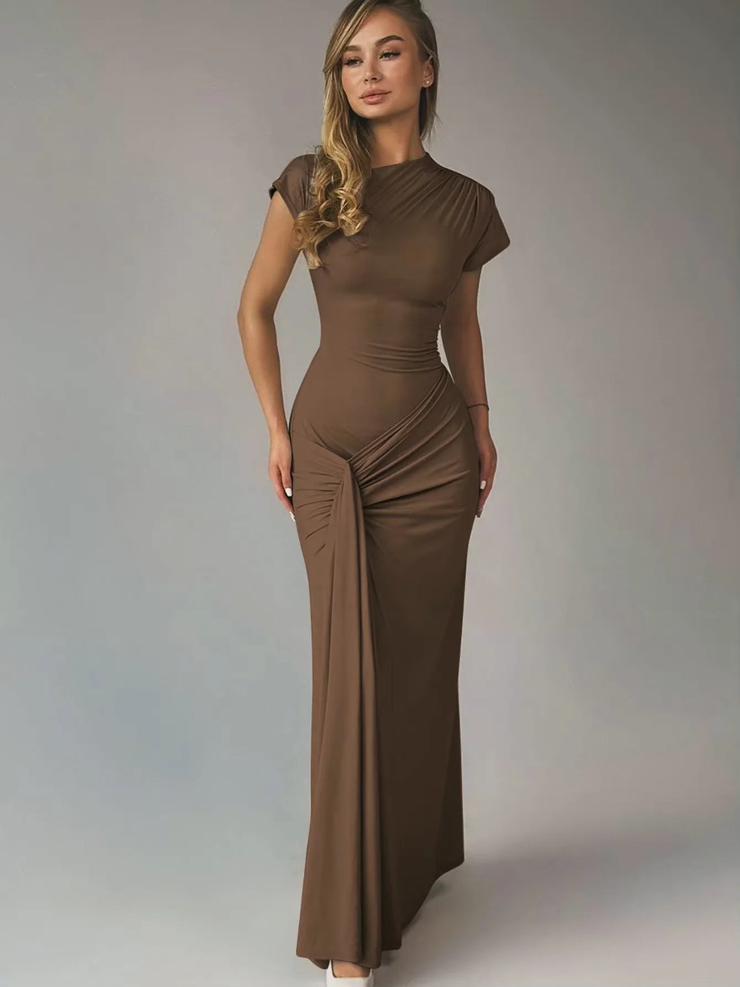 Navy blue ruched maxi dress with capped sleeves, perfect for an evening out or a special occasion.