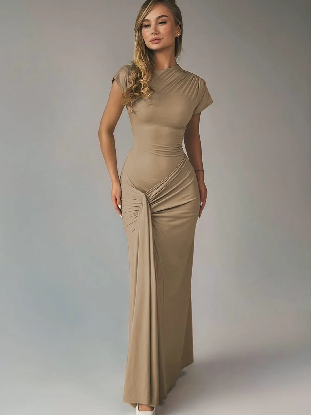 Clare maxi dress in a flattering ruched design with capped sleeves, made from breathable and comfortable fabric.
