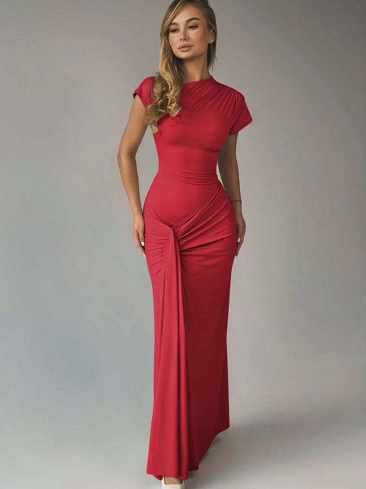 Navy blue ruched maxi dress with capped sleeves, perfect for a casual chic look on warm summer days.