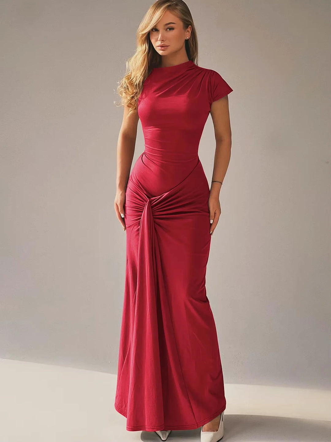 Black ruched maxi dress with capped sleeves, perfect for formal events. Made from stretchy, comfortable fabric.