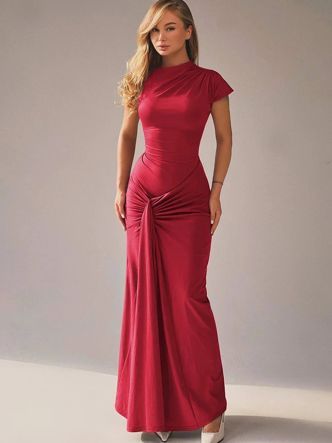 Red ruched maxi dress with capped sleeves, perfect for any occasion. Made from a soft and stretchy fabric for a comfortable…