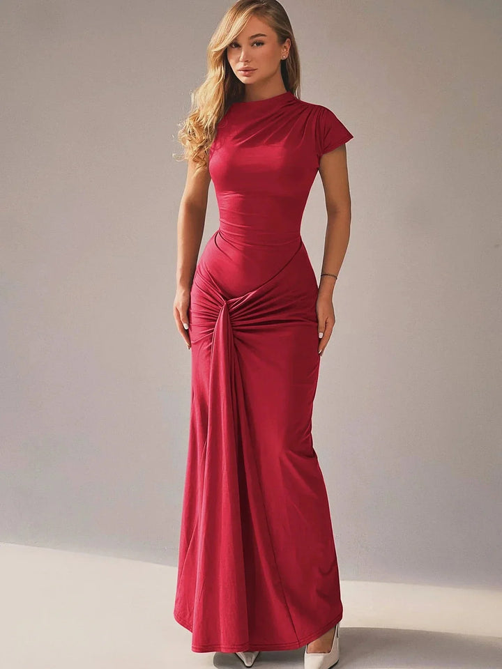 Red ruched maxi dress with capped sleeves, perfect for any occasion. Made from a soft and stretchy fabric for a comfortable…
