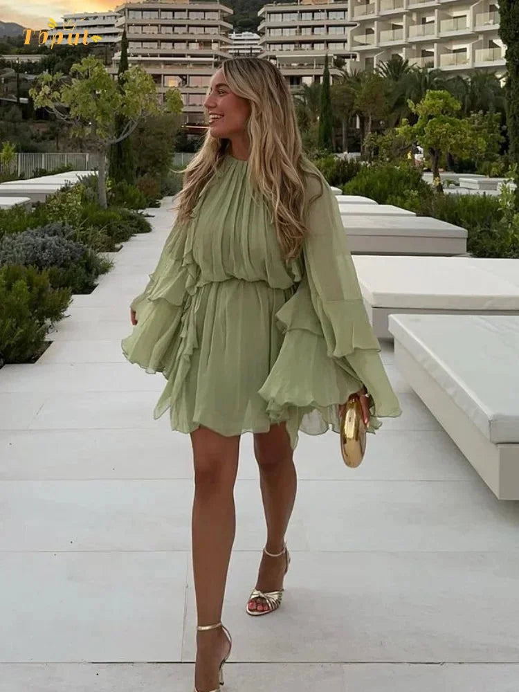 Ethereal sage dress with layered ruffles, airy and delicate design, perfect for a whimsical touch to your wardrobe.