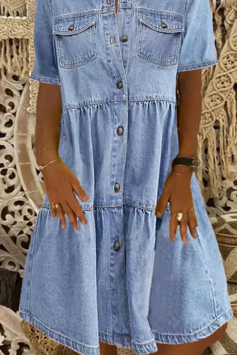 Denim dress with short sleeves and pockets, perfect for casual and comfortable wear.