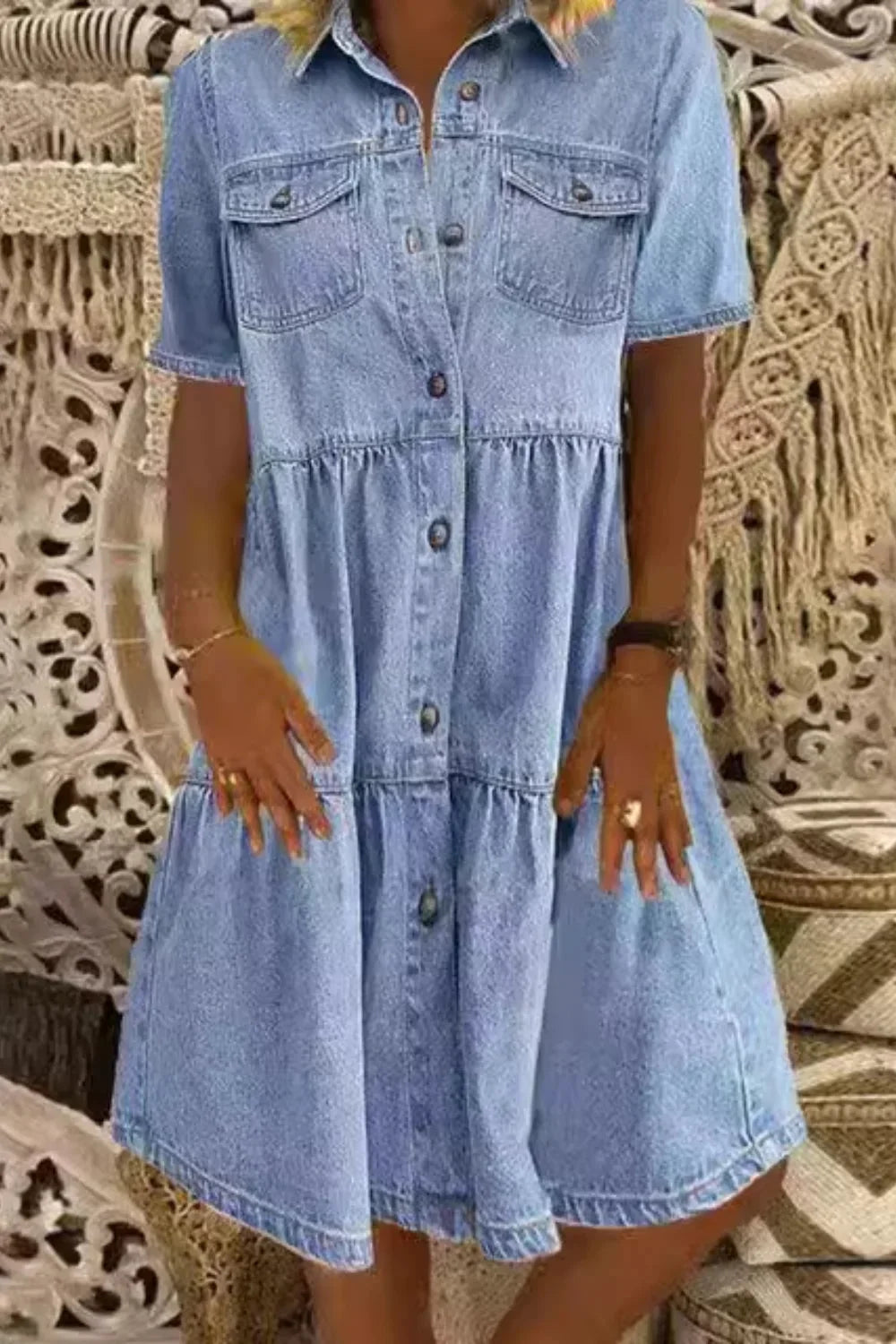 Sky blue short sleeve denim dress with pockets, perfect for a casual yet stylish look. Features a relaxed fit and convenient…
