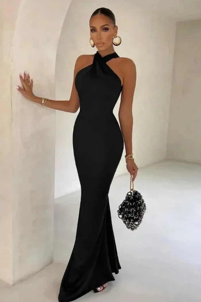 Black maxi dress with fitted silhouette, made from soft, stretchy fabric. Features elegant and sleek design perfect for…