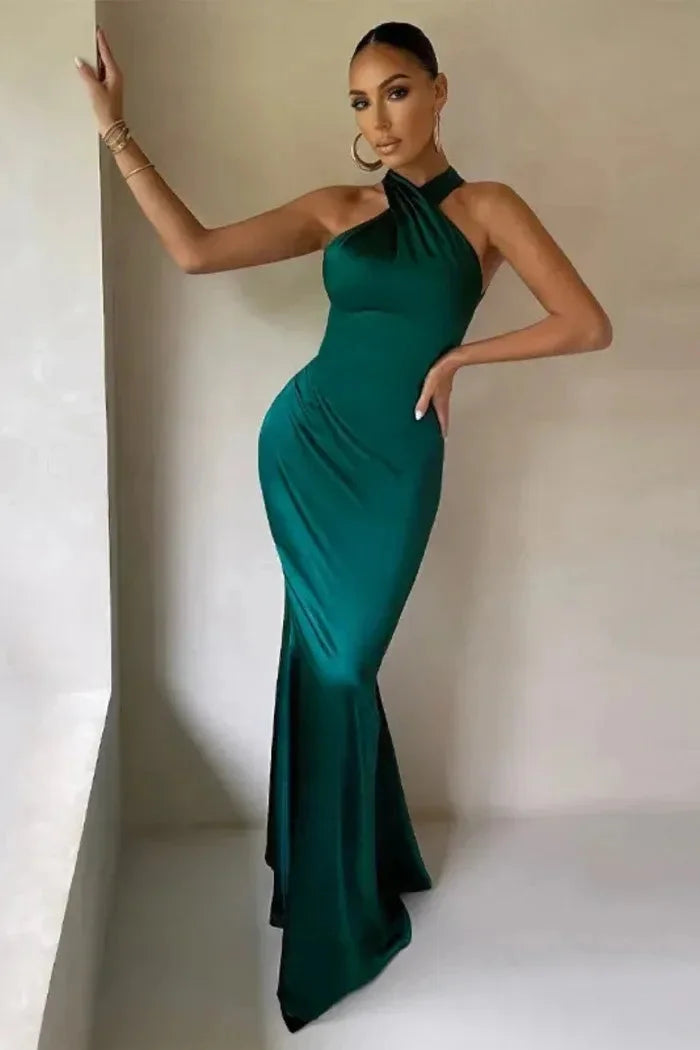 Green Cordelia maxi dress with a sleek silhouette, perfect for special occasions. Made of a figure-flattering fabric with a…