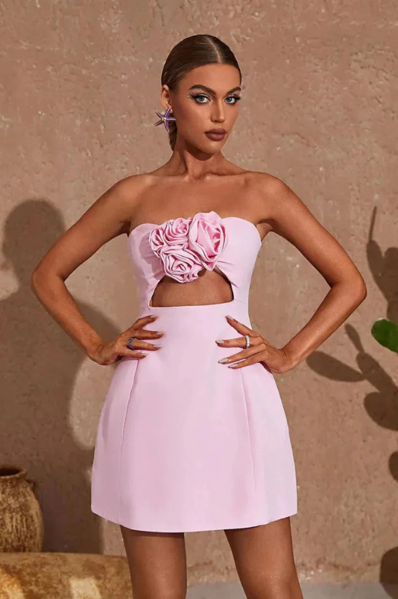 Strapless mini dress featuring floral accent, made with crystal-embellished fabric in a flirty silhouette.