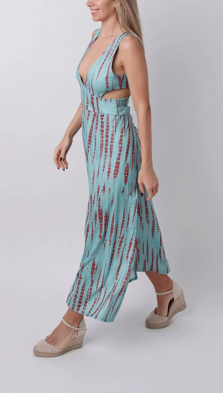 Tie-dye dress with a plunging neckline, featuring a split hem. Trendy and soft, perfect for casual occasions.