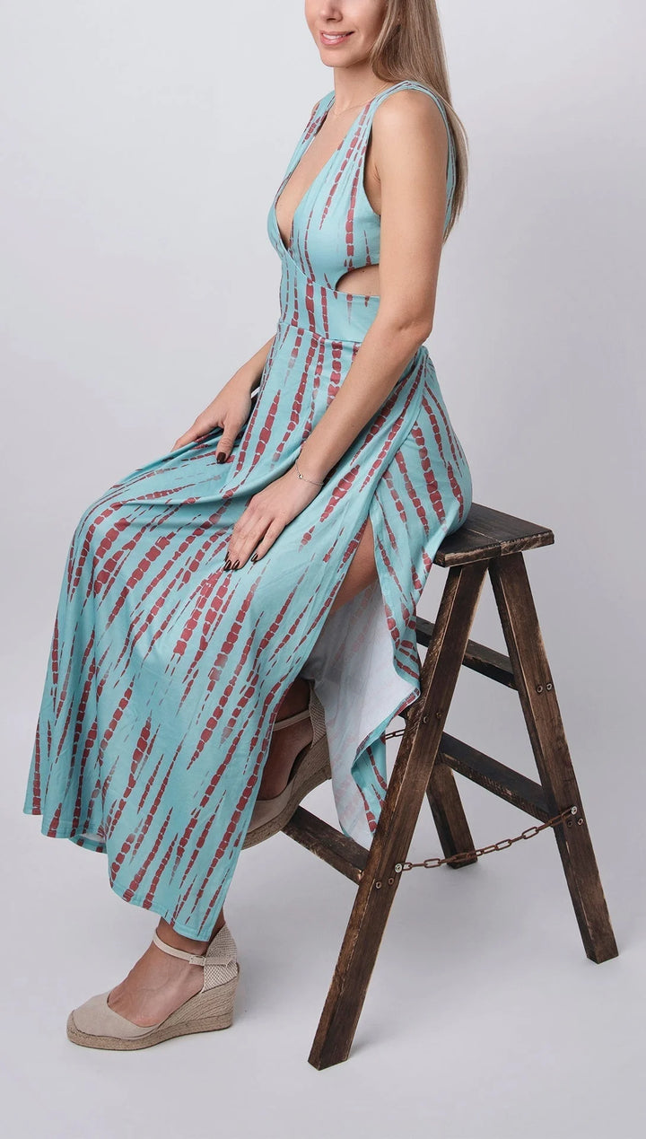 Light blue tie-dye dress with plunge neckline and split, made of soft cotton blend, perfect for casual summer days.