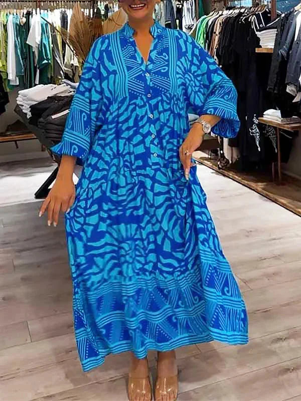 Blue flowy maxi dress with a delicate print, suitable for all body types. Made with soft and breathable material for…