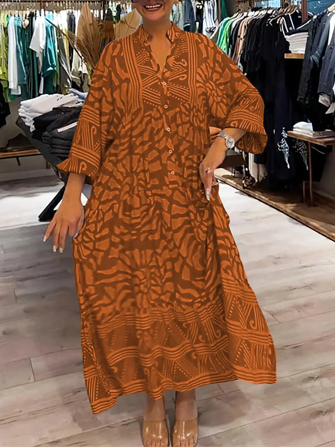 Orange flowy printed maxi dress with flattering silhouette for all body types. Made from lightweight, breathable fabric for…