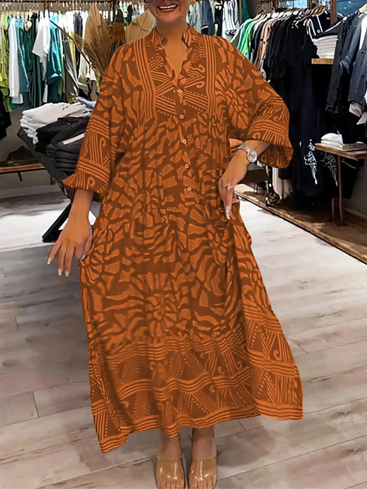 Orange flowy printed maxi dress with flattering silhouette for all body types. Made from lightweight, breathable fabric for…
