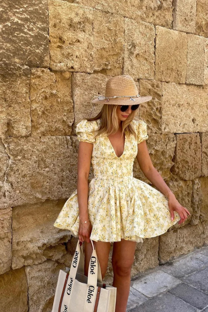 Yellow floral dress with back tie, made of soft breathable fabric. Features a charming floral pattern and a stylish back tie…