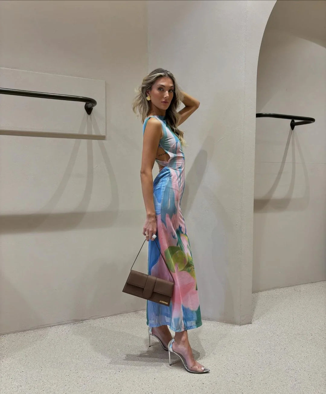 "Sleeveless tropical print maxi dress in a vibrant and breezy design with a relaxed fit, perfect for summer outings."