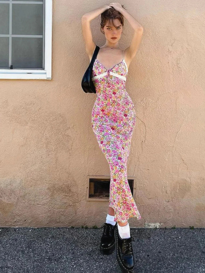 Pink floral sundress with lace accents, perfect for summer days. Made of lightweight fabric with feminine design details.