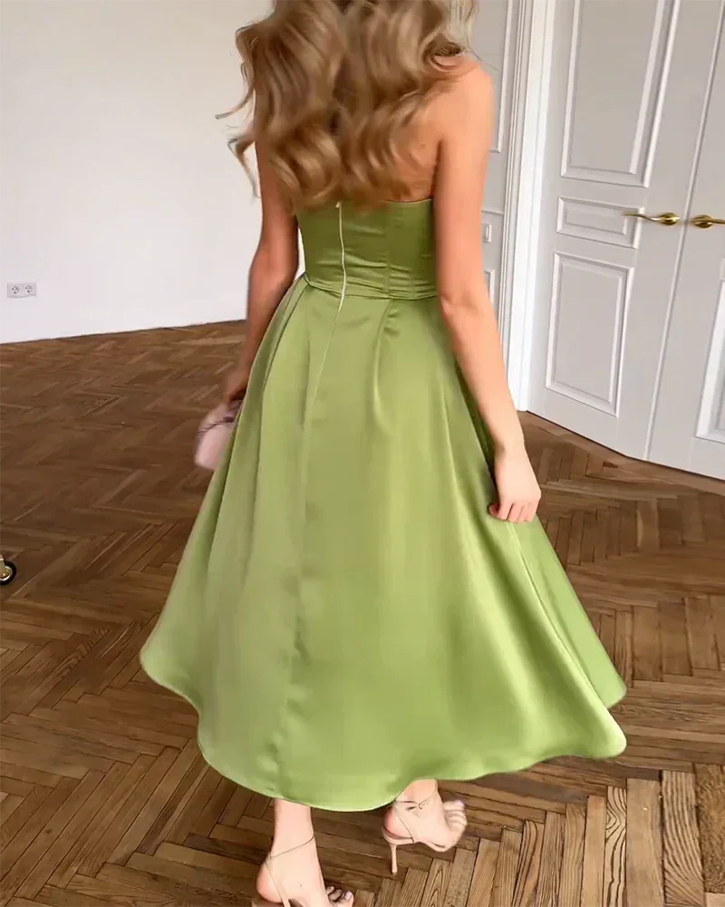 Strapless olive green midi dress with a sweetheart neckline, ideal for casual or semi-formal occasions.