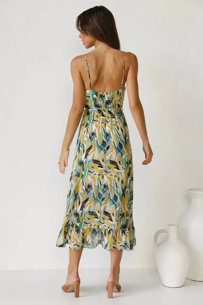 "Dearra - Flowy maxi dress with vibrant abstract print, featuring soft and breathable fabric ideal for summer outings."