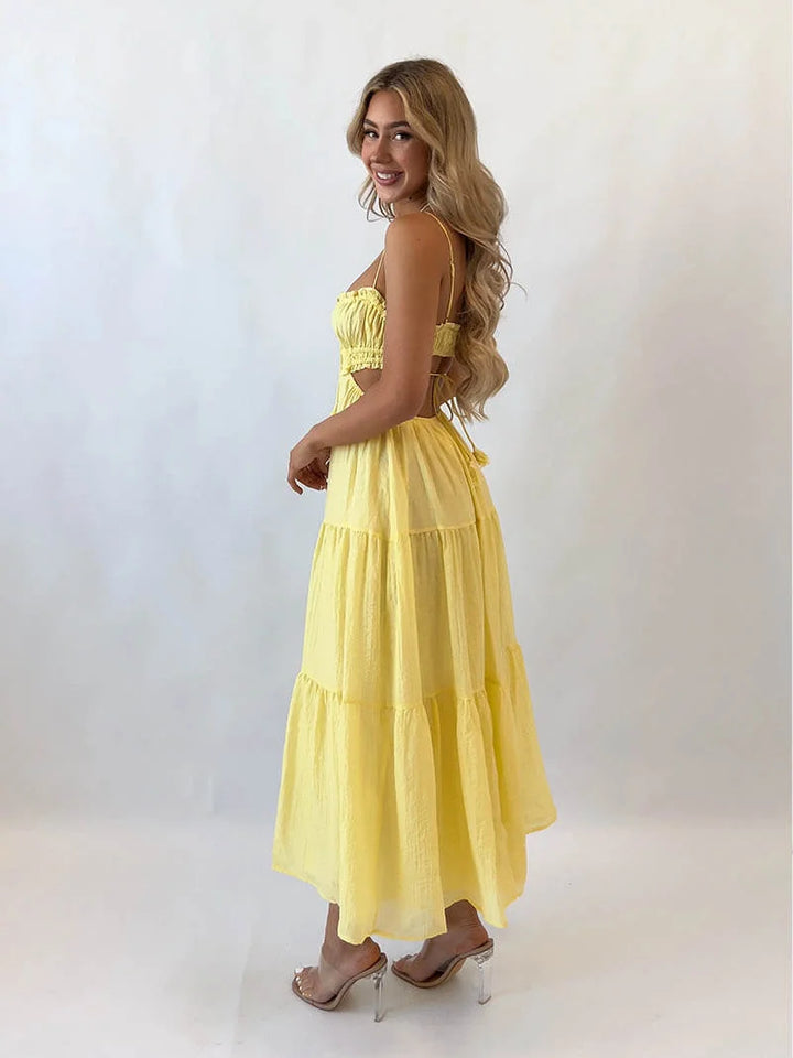 "Delila tiered maxi dress in floral print with adjustable drawstring waist, perfect for a casual day out or beach vacation."