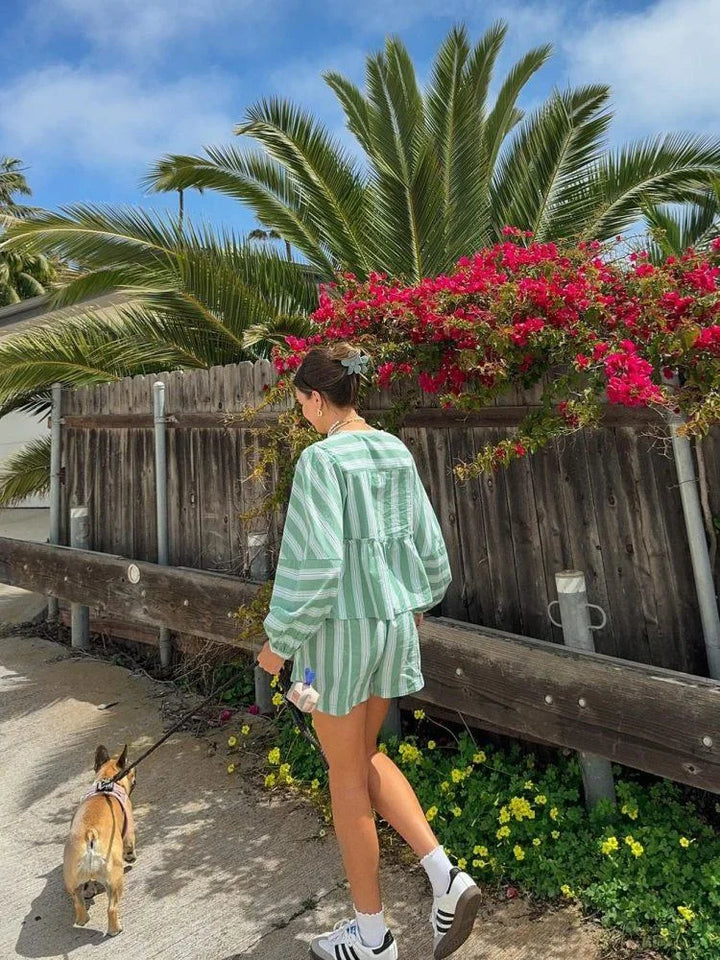 Green striped shorts and blouse summer outfit for women. Lightweight cotton blend with a refreshing design perfect for warm…