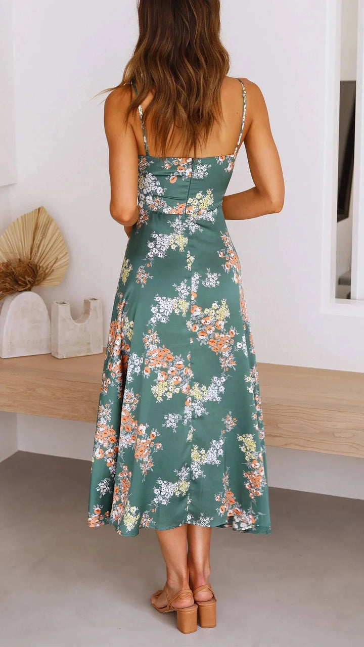 Teal floral satin dress with front tie, elegantly designed with a beautiful floral print and a stylish front tie detail.