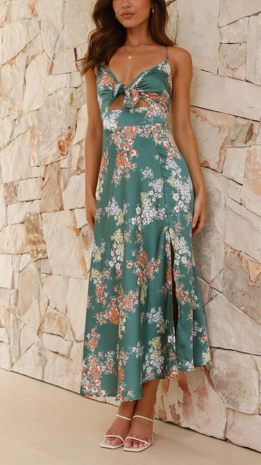 Teal floral satin dress with front tie featuring a vibrant floral pattern and elegant satin material for a chic and…