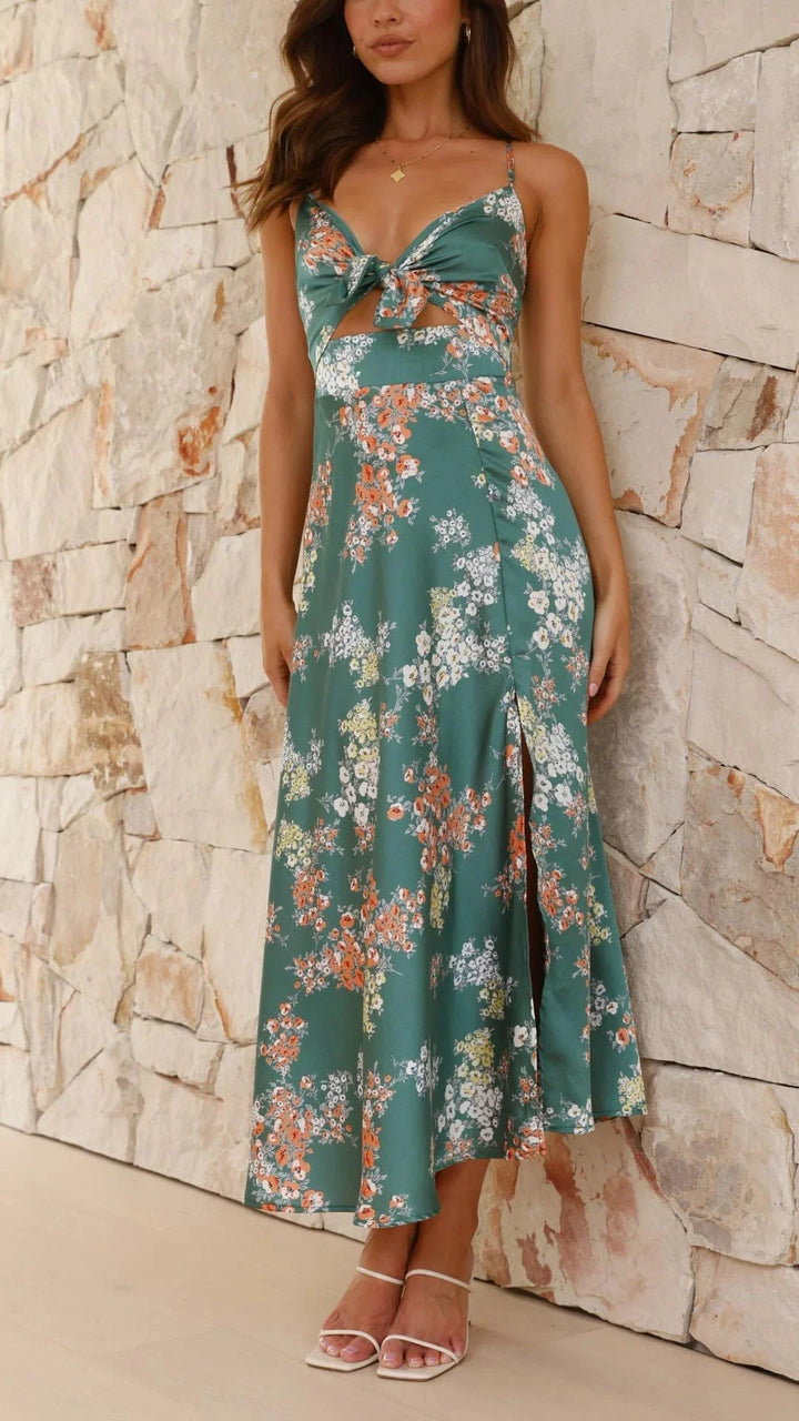 Teal floral satin dress with front tie featuring a vibrant floral pattern and elegant satin material for a chic and…