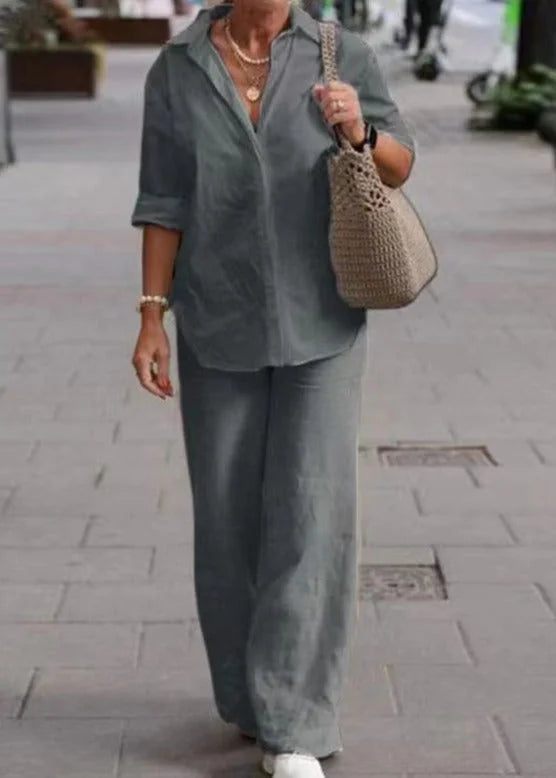 Grey cotton blend crewneck sweater with ribbed cuffs and hem. Simple and versatile design suitable for casual everyday wear.