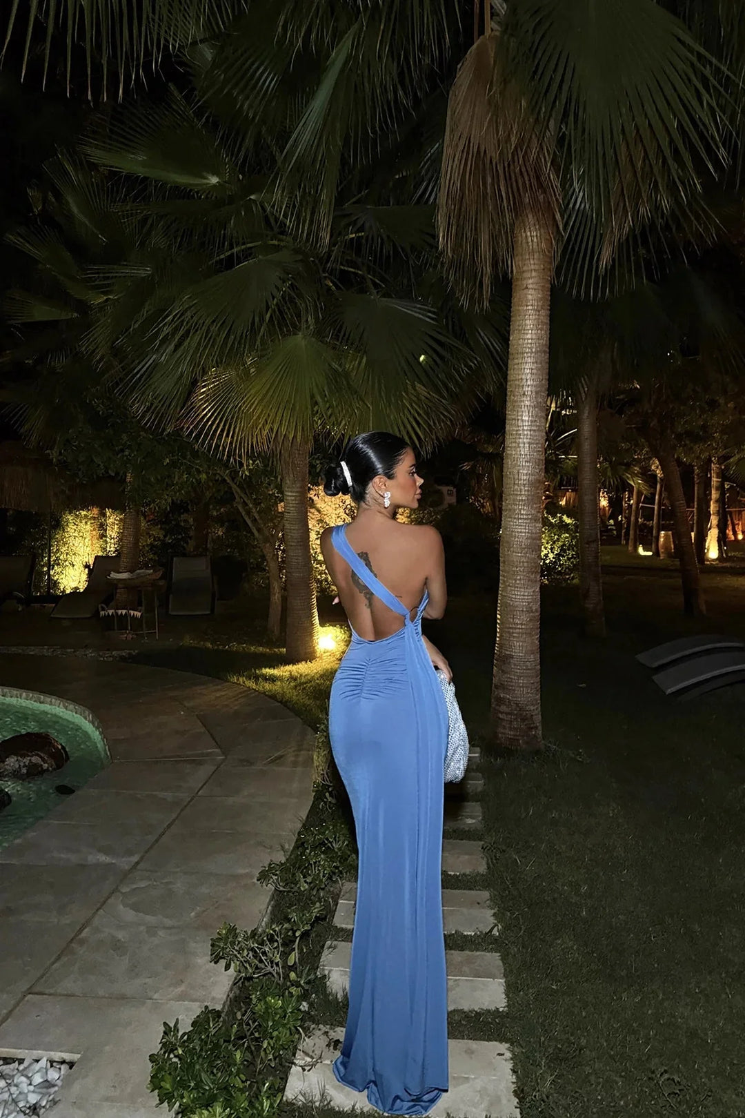 Asymmetric blue maxi dress with side slit, made from flowy fabric with elegant silhouette, perfect for casual or semi-formal…